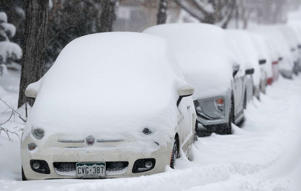 PHOTO: A long line of parked vehicles sits covered with snow as a snowstorm sweeps in over the region, Nov. 26, 2019, in Denver.