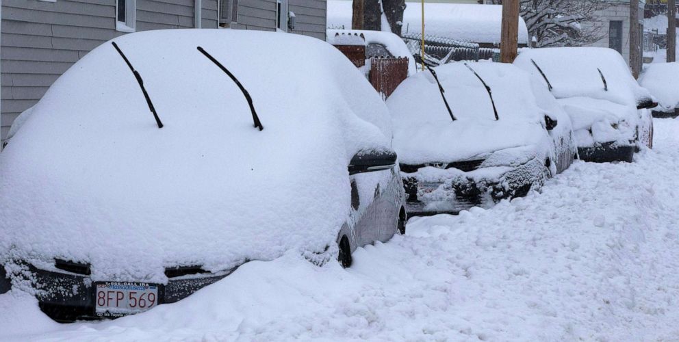 PHOTO: Snow covered vehicles line a street in Lowell, Mass., Dec. 2, 2019, during the first winter storm of the season.