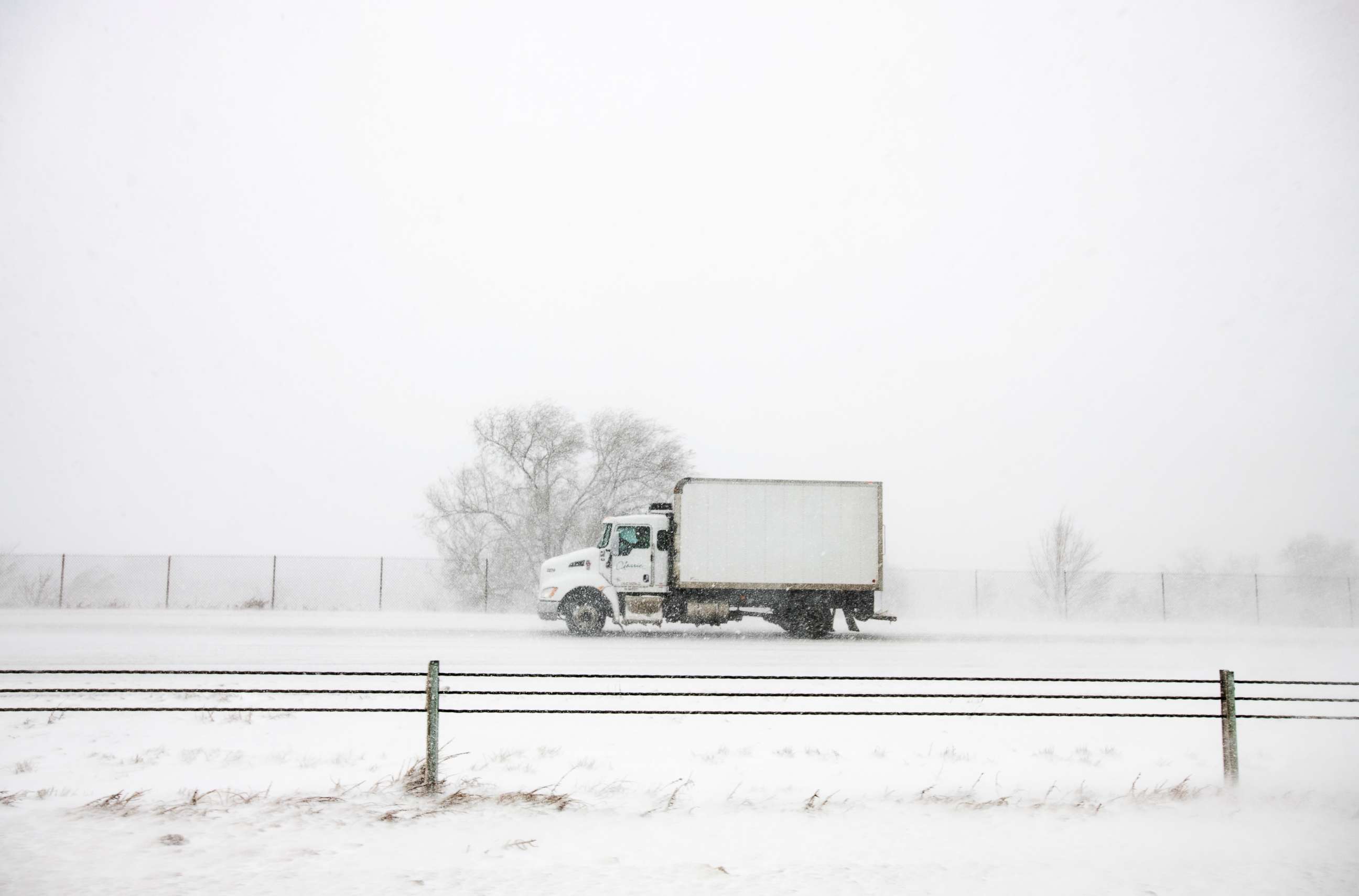 PHOTO: A truck drives north on I-25 during the snowstorm in Colorado Springs, Colo., March 13, 2019. 