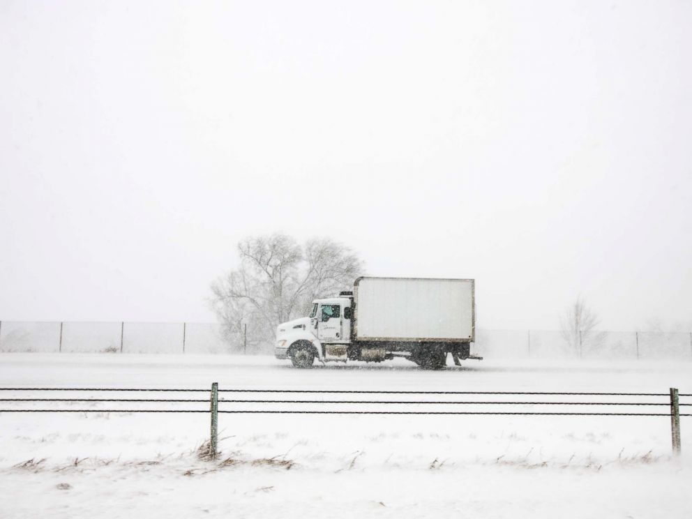 PHOTO: A truck drives north on I-25 during the snowstorm in Colorado Springs, Colo., March 13, 2019.