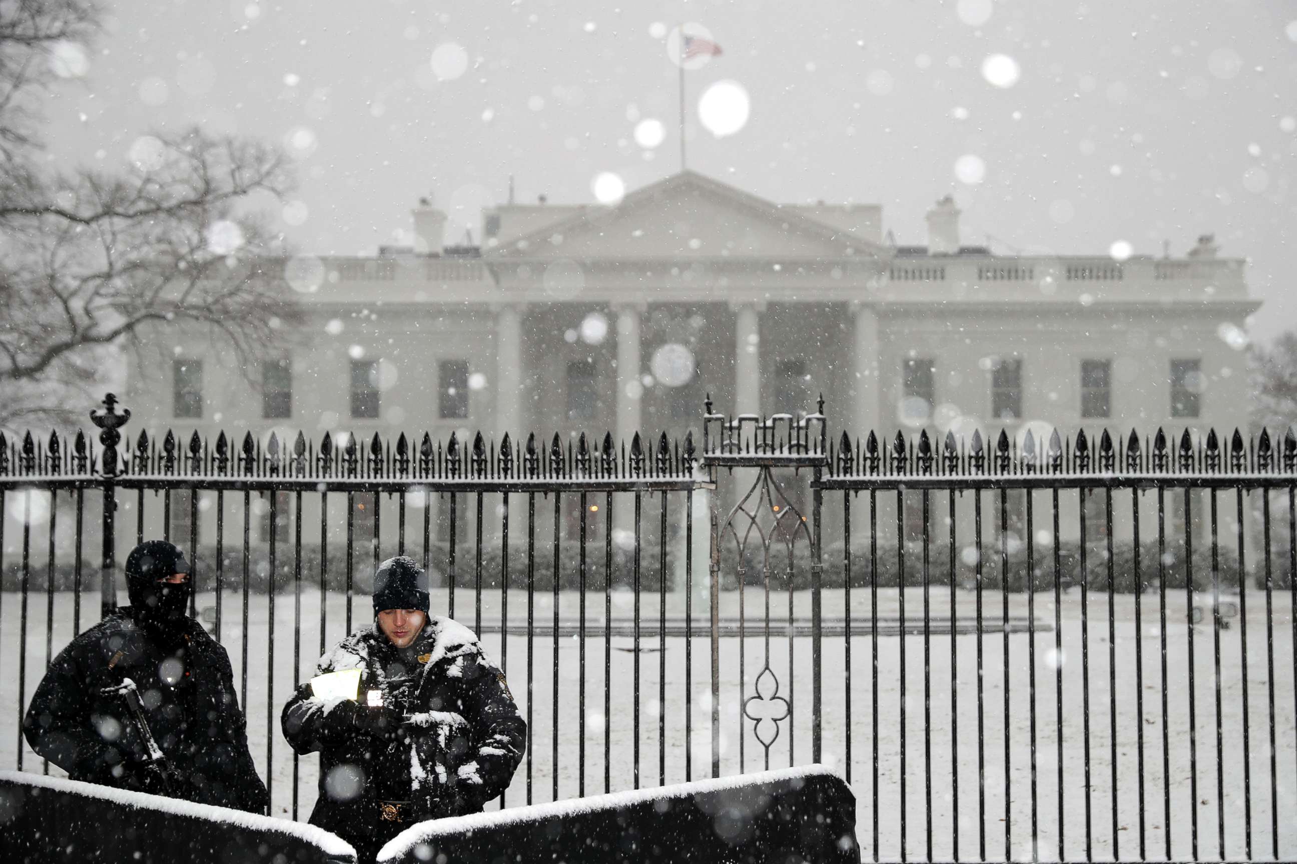 PHOTO: U.S. Secret Service Uniform Division officers stand watch as heavy snow falls at the White House, Feb. 20, 2019, in Washington, D.C.