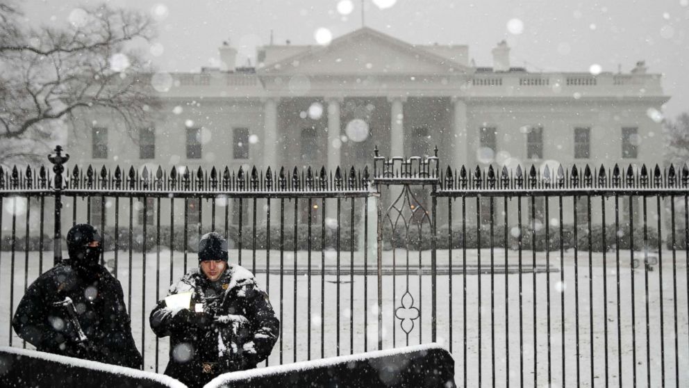 U.S. Secret Service Uniform Division officers stand watch as heavy snow falls at the White House, Feb. 20, 2019, in Washington, D.C.