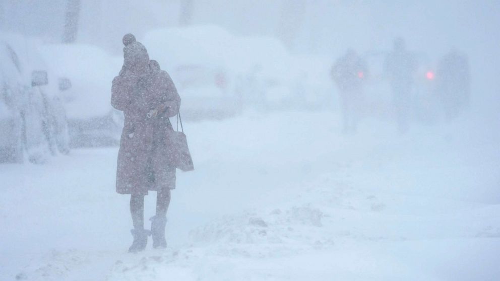 PHOTO: A woman walks in white-out conditions in Jersey City, N.J., on Feb. 1, 2021.