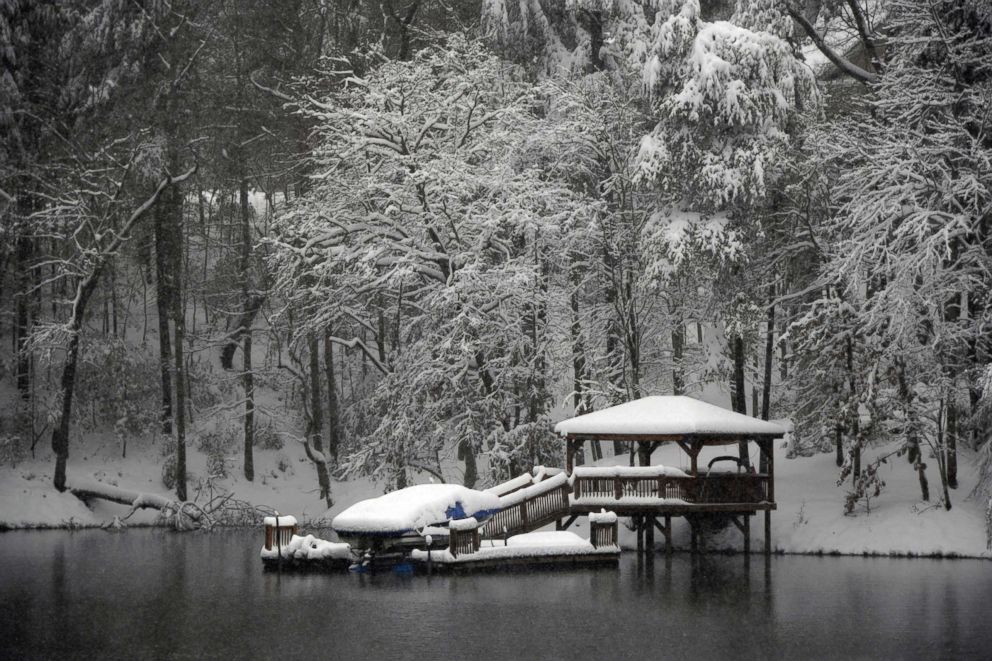 PHOTO: A dock and gazebo is covered with a thick layer of snow on Lake James, Dec. 9, 2018 in Morganton, N.C.