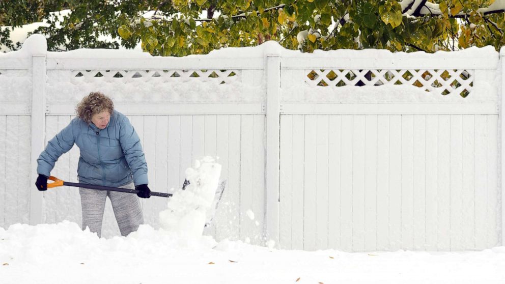 2 feet of snow slams the Dakotas, California fires rage on