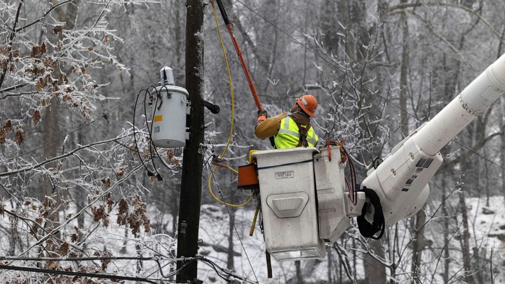 PHOTO: A worker fixes power lines following a winter storm near High Falls, N.Y., Feb. 7, 2022.