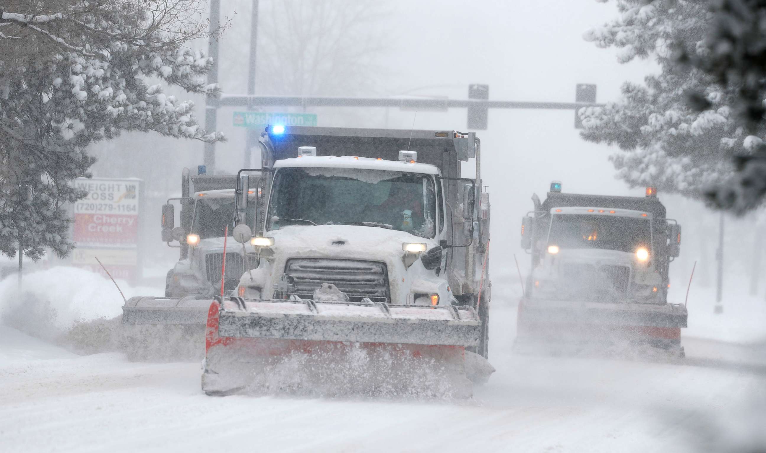 PHOTO: City of Denver snowplows clear the eastbound lanes of Speer Blvd. as a storm packing snow and high winds sweeps in over the region, Nov. 26, 2019, in Denver.