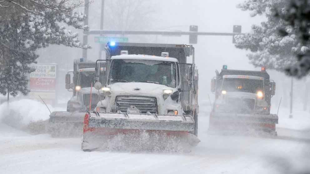 PHOTO: City of Denver snowplows clear the eastbound lanes of Speer Blvd. as a storm packing snow and high winds sweeps in over the region, Nov. 26, 2019, in Denver.