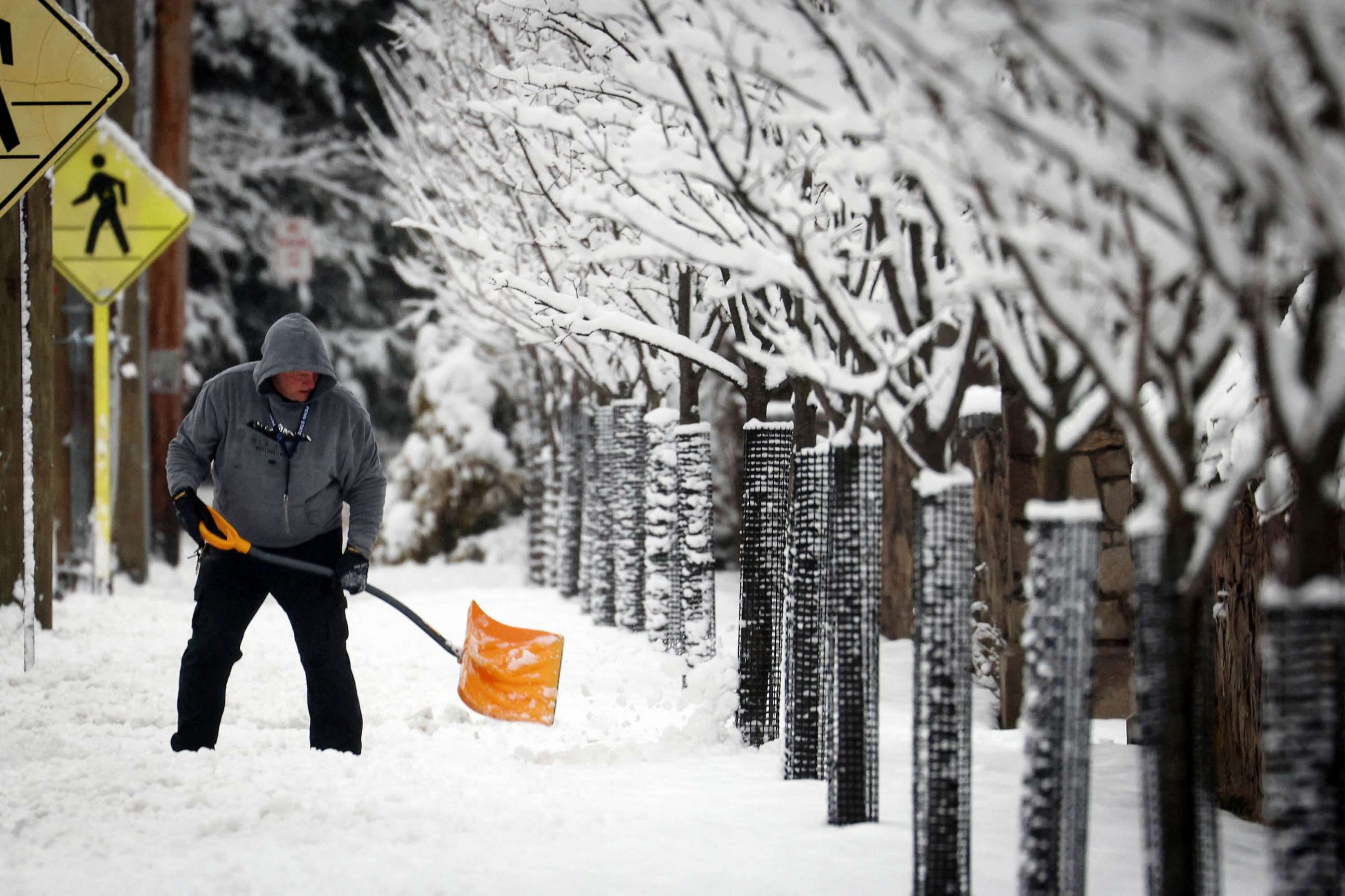 PHOTO: A man shovels snow during a winter storm in the New York City suburban Village of Upper Nyack, New York, Feb. 28, 2023.