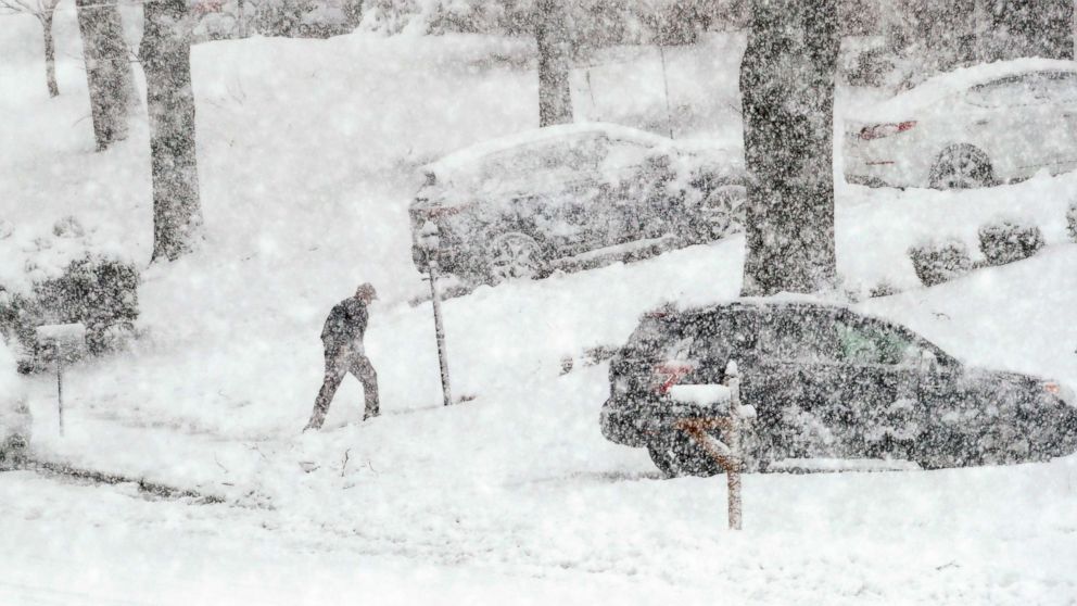 PHOTO: A man walks back from his mail box during a winter storm, March 7, 2018, in Springfield, Pa. 