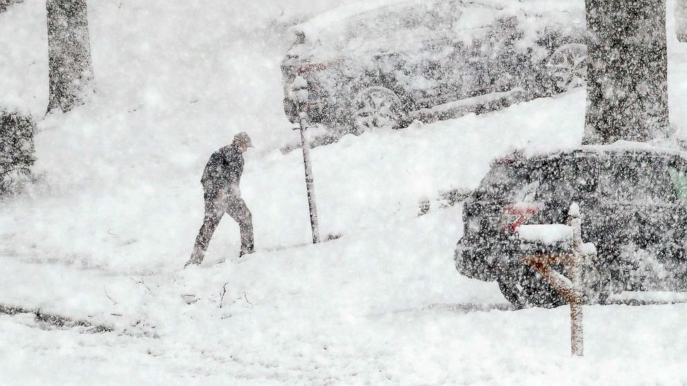 PHOTO: A man walks back from his mail box during a winter storm, March 7, 2018, in Springfield, Pa. 