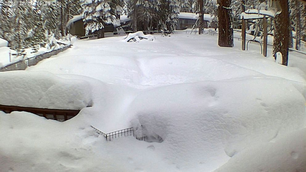 PHOTO: Snow is pictured in a Lake Tahoe residential backyard in this still image from a video in South Lake Tahoe, Calif., Dec. 27, 2021.