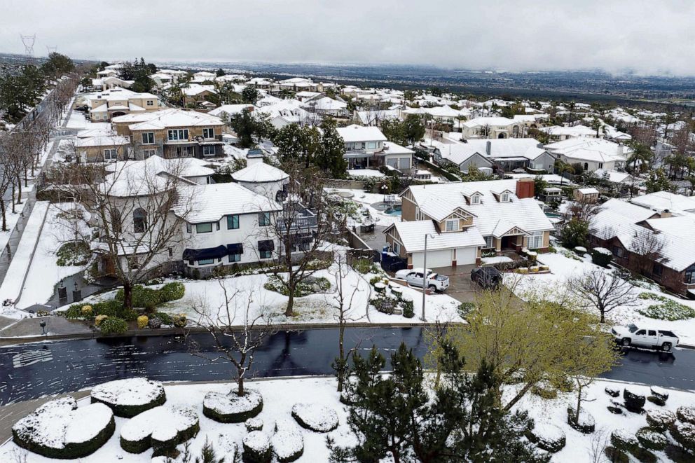 PHOTO: Snow covers homes in the Haven Estates neighborhood of Rancho Cucamonga, Calif., Feb. 25, 2023.