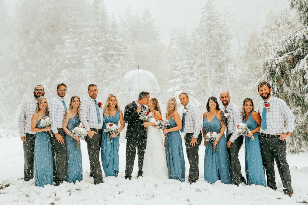 PHOTO: A bride and groom expecting fall foliage as the background of their wedding day were greeted by a snowstorm in Mount Spokane, Wash., Sept. 28, 2019.