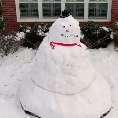 This family worked together to build a massive 10-foot snowman.