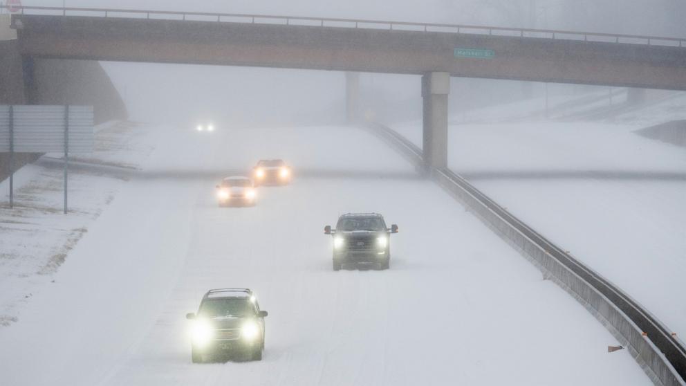 PHOTO: Cars drive in the snow on Jan. 24, 2026, in Little Rock, Arkansas. A massive winter storm is bringing frigid temperatures, ice, and snow to nearly 200 million Americans.