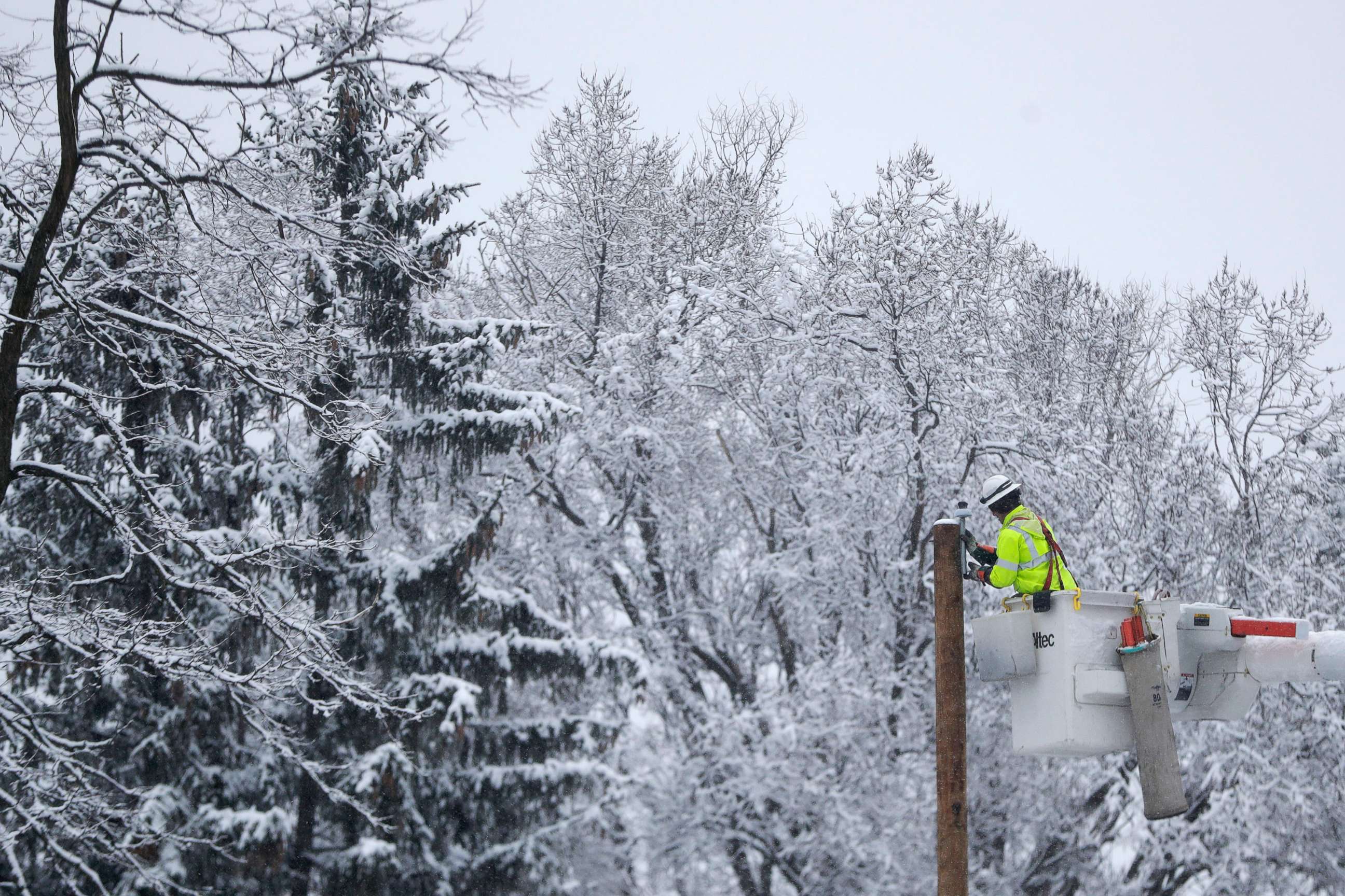 PHOTO: Phil Blair, a utility worker with PotomacEdison out of West Virginia, works on setting up a new power line as a crew works on restoring power along Molly Stark Drive ahead of a winter storm, Wednesday, March 7, 2018, in Morristown, N.J. 