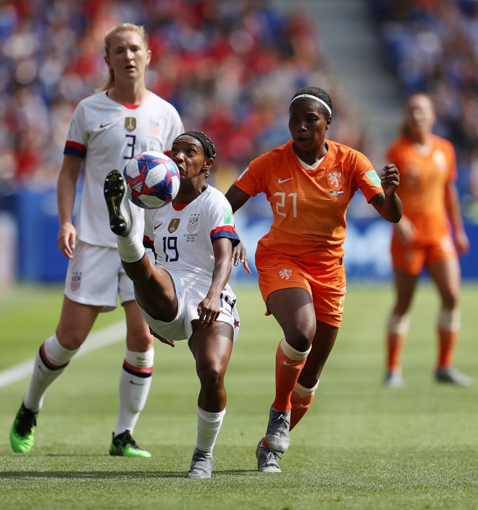 PHOTO:Crystal Dunn of the U.S. clears the ball as she is put under pressure by Lineth Beerensteyn of the Netherlands during the 2019 FIFA Women's World Cup France final match in Lyon, France. 