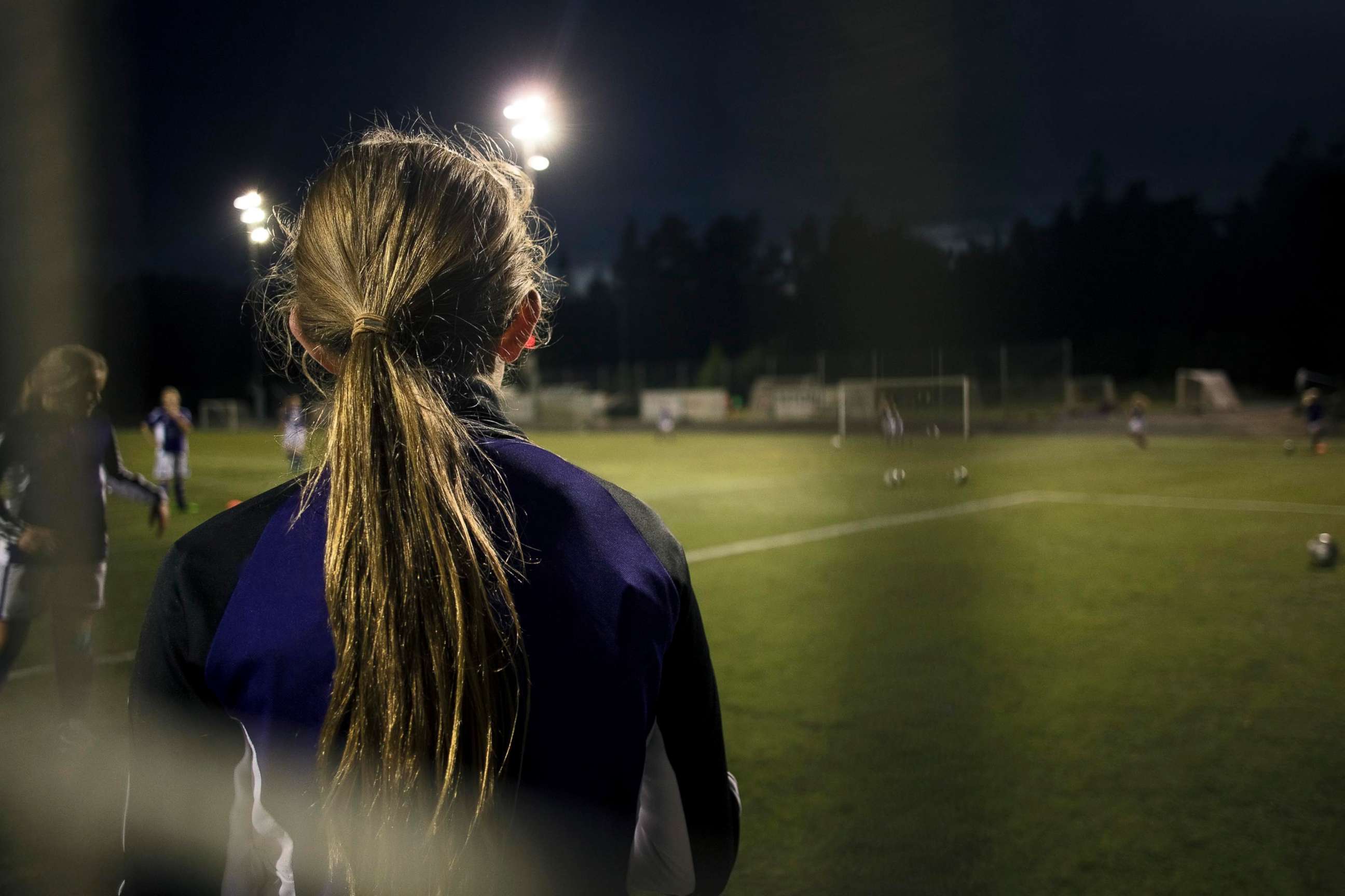 PHOTO: Girls play soccer. 