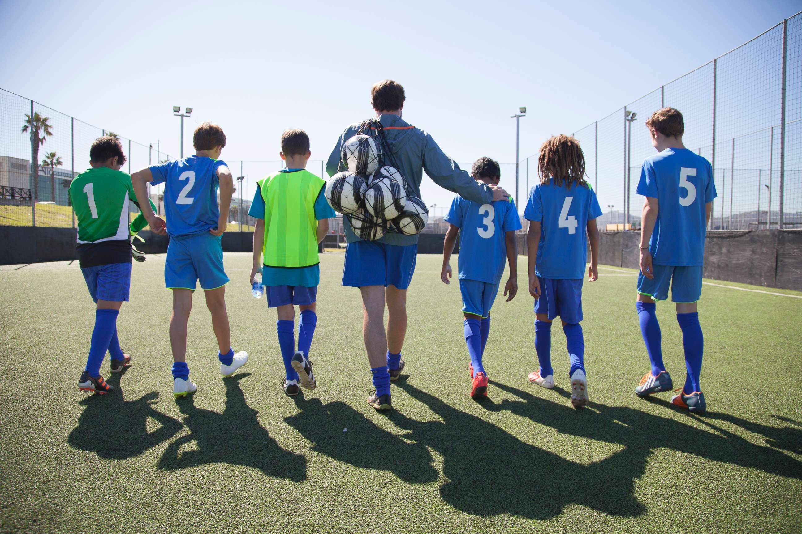 PHOTO: Boys in a soccer team walk out for a game with their coach in this undated stock photo.