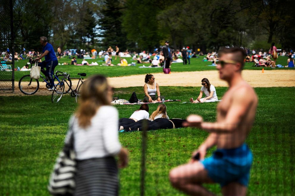 PHOTO: People hang out in Central Park maintaining during the coronavirus pandemic as spring weather warmed up in the Manhattan borough of New York City, May 2, 2020. 