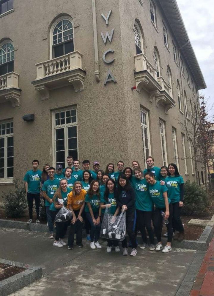 PHOTO: College students stand outside a Boston YWCA before distributing free socks.