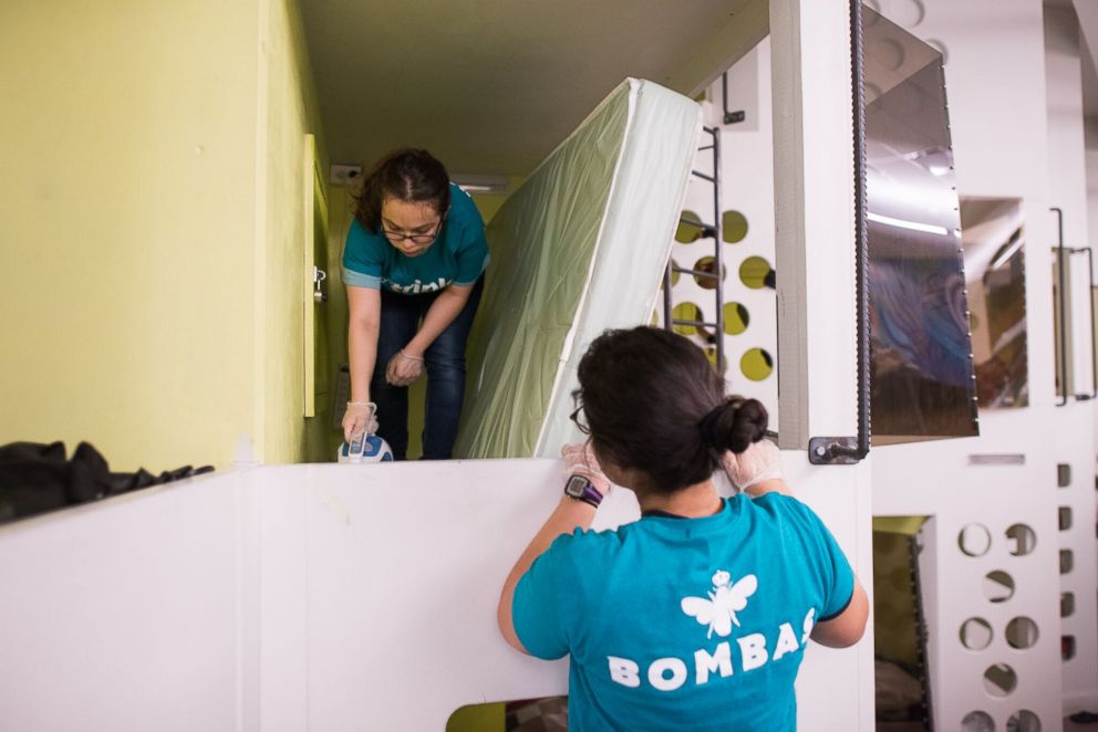 PHOTO: College students make repairs inside a Boston homeless shelter.