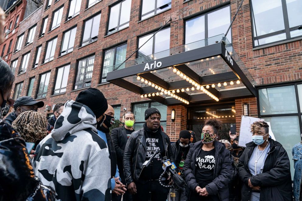 PHOTO: Kayon Harrold with his wife Kat Rodriguez on his left speaks during Arlo hotel national protest in New York City in front of Arlo SoHo in New York on January 16, 2021.