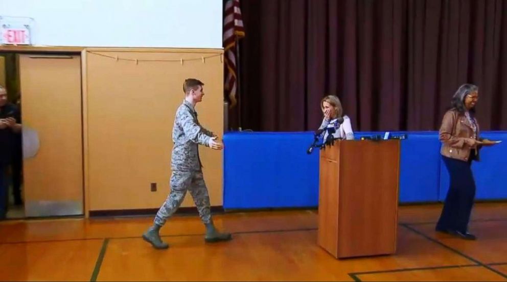 PHOTO: Regina Benzing was surprised at her school when her son Eric Benzing appeared, April 18, 2018. Eric Benzing, an Air Force specialist, had been in Germany since September.