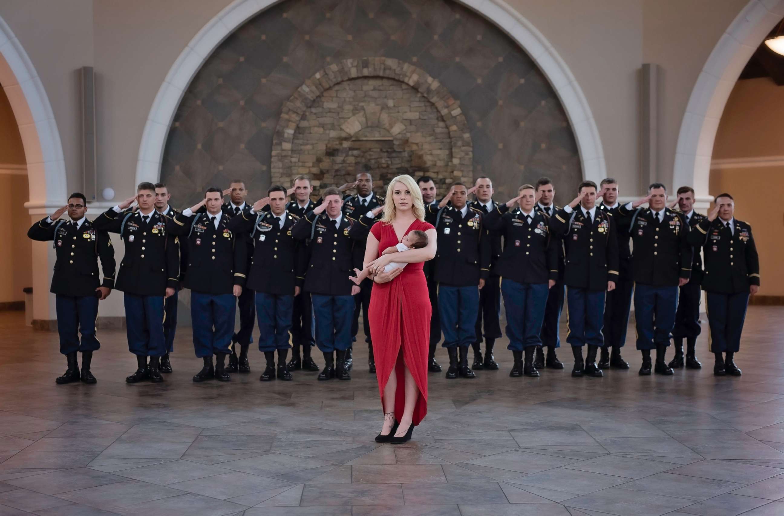 PHOTO: Christian Harris, the daughter of Army Specialist Chris Harris who was killed last year, took part in a special photo shoot with some of Harris' former comrades and her mother, Britt Harris.