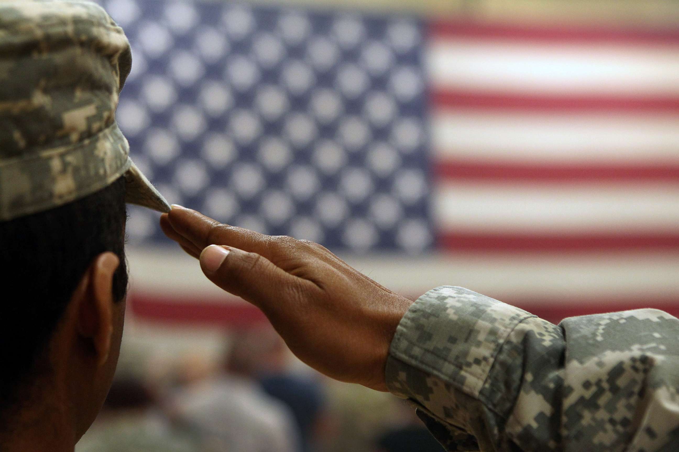 PHOTO: A soldier salutes the flag during a welcome home ceremony for troops arriving from Afghanistan in this June 15, 2011 file photo to Fort Carson, Colo.