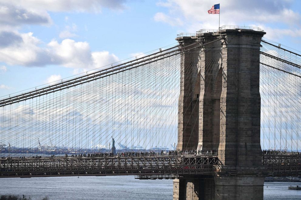 PHOTO: People walk over the Brooklyn Bridge during the Solidarity March: No Hate. No Fear. in New York, Jan. 5, 2020.