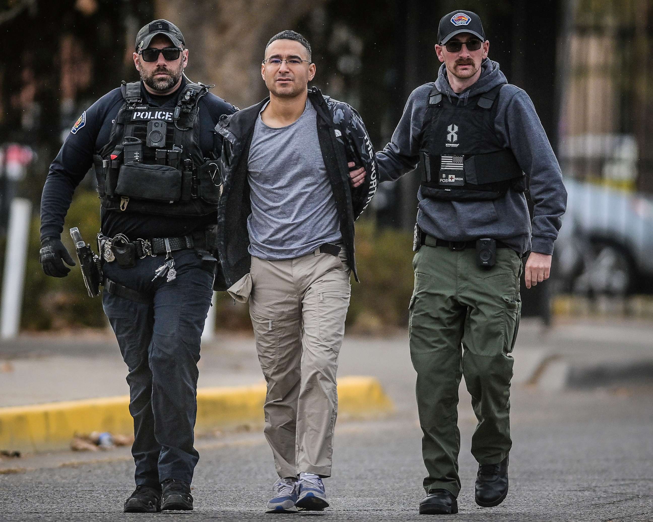 PHOTO: Solomon Peña, Republican Candidate for New Mexico House District 14, being taken into custody by APD police officers in SW Albuquerque, N.M., on Jan. 16, 2023.