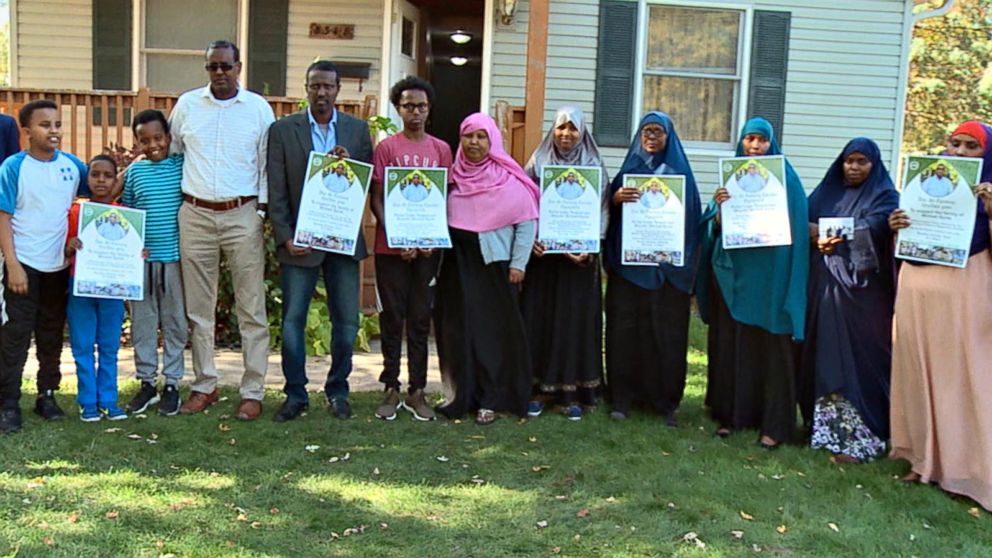 PHOTO: The grieving extended family of Ahmed Abdikarin Eyow, who was killed in a terrorist attack in Mogadishu, Somalia on Oct. 14, 2017, hold signs for a fundraiser in his memory. 