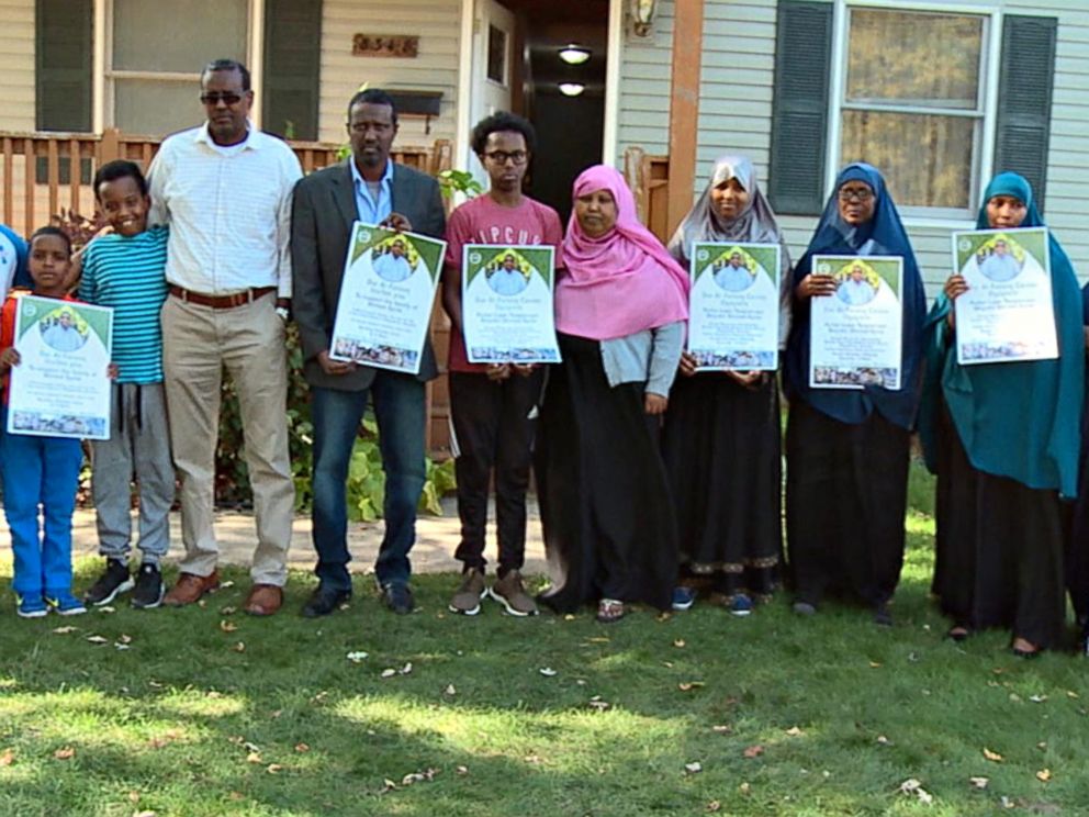 PHOTO: The grieving extended family of Ahmed Abdikarin Eyow, who was killed in a terrorist attack in Mogadishu, Somalia on Oct. 14, 2017, hold signs for a fundraiser in his memory.