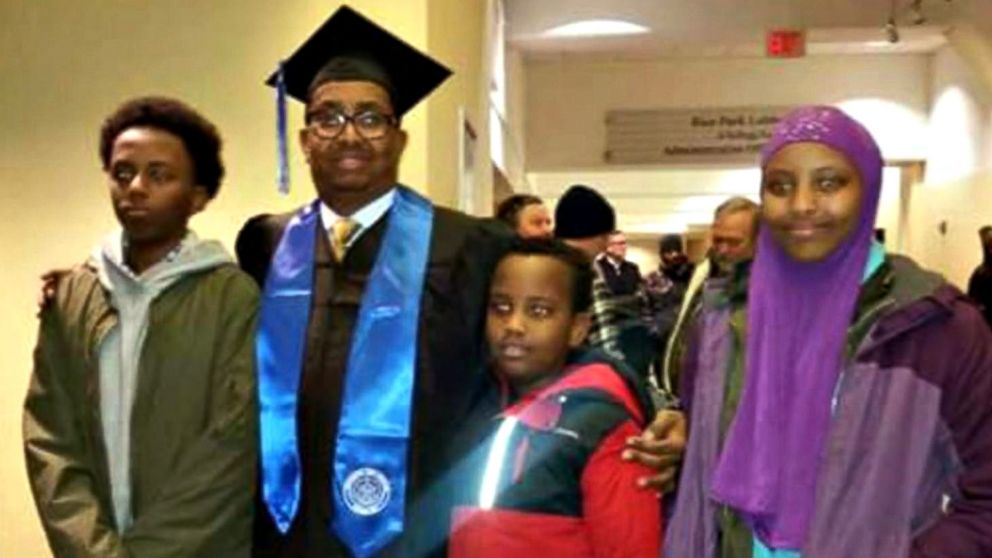 PHOTO: Ahmed Abdikarin Eyow, shown here in a graduation gown with his three children Yonis, Yahya and Yusra, was passionate about education.