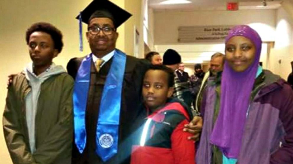 Ahmed Abdikarin Eyow, shown here in a graduation gown with his three children Yonis, Yahya and Yusra, was passionate about education.