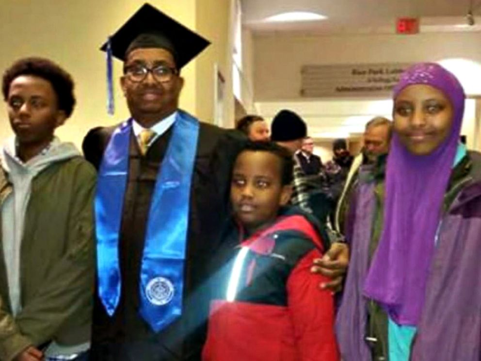 PHOTO: Ahmed Abdikarin Eyow, shown here in a graduation gown with his three children Yonis, Yahya and Yusra, was passionate about education.