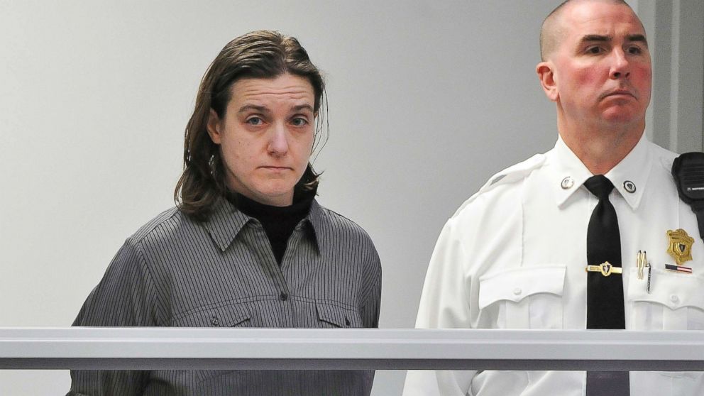 In this Jan. 22, 2013, file photo, Sonja Farak, left, stands during her arraignment at Eastern Hampshire District Court in Belchertown, Mass.