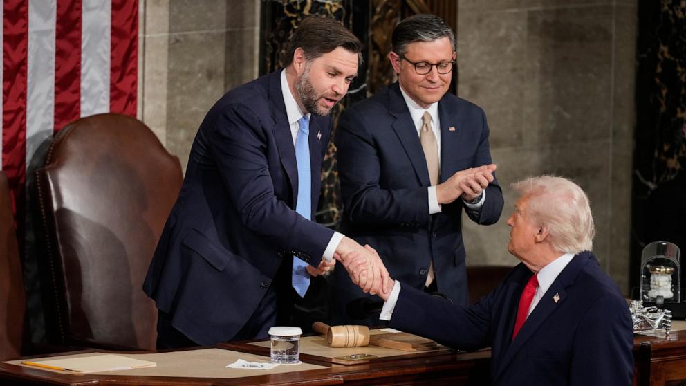 PHOTO: Vice President JD Vance and Speaker Mike Johnson shake hands with President Donald Trump following his State of the Union address to a joint session of Congress in the House chamber at the U.S. Capitol in Washington, Feb. 24, 2026.