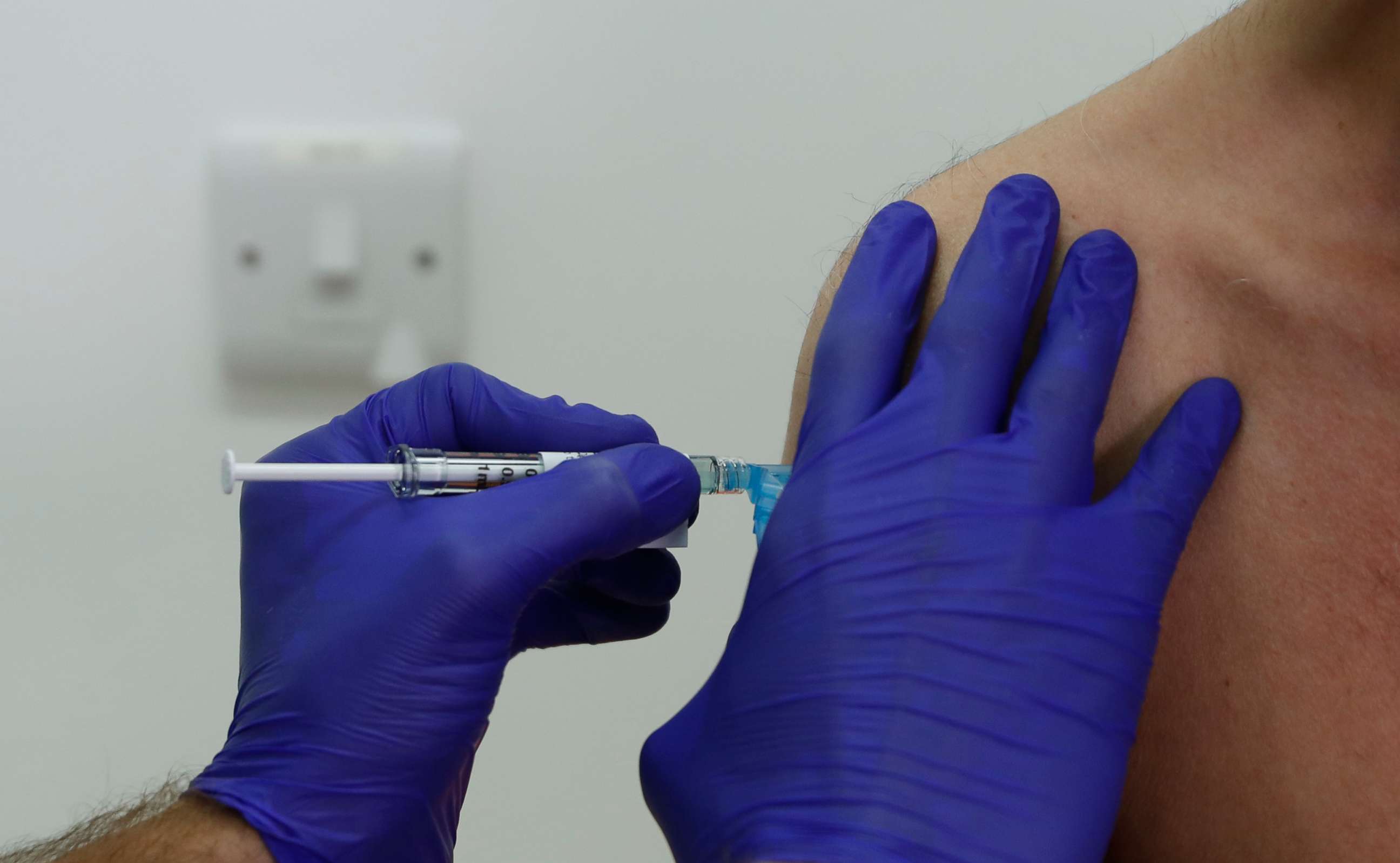PHOTO: A volunteer is given an injection at St George's University hospital in London on Oct. 7, 2020. Novavax Inc. said its COVID-19 vaccine appears 89% effective based on a study and that it seems to work against new mutated strains of the virus.