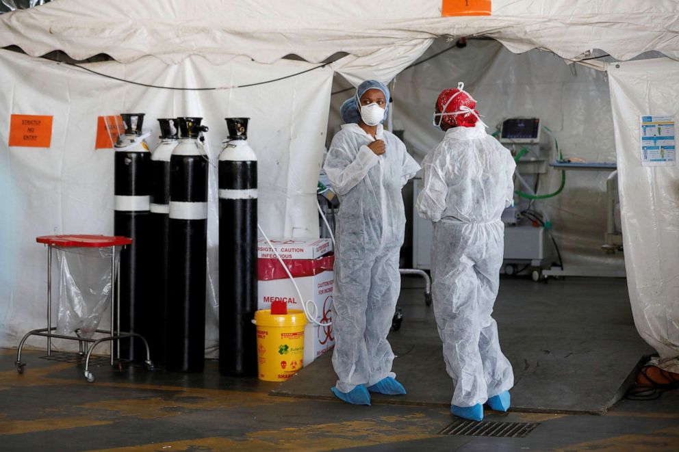 FILE PHOTO: Health care workers chat at a temporary ward setup, during the COVID-19 outbreak, at Steve Biko Academic Hospital in Pretoria, South Africa, Jan. 19, 2021.