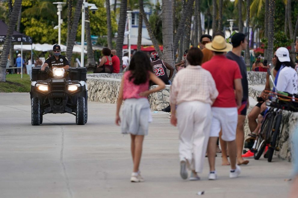 A police officer on an ATV patrols in Miami Beach, Florida's famed South Beach,  March 22, 2021. City of Miami Beach officials declared a state of emergency on March 21, 2022, and an upcoming curfew, in a bid to curb violent incidents during spring break.