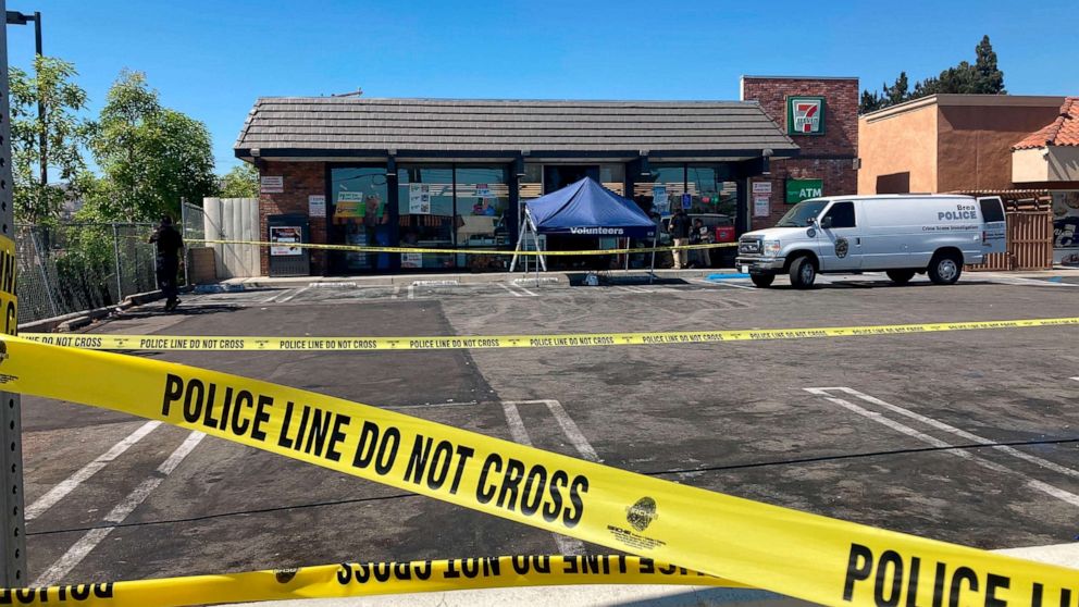 PHOTO: Police crime scene tape closes off a parking area following a shooting at a 7-Eleven store in Brea, Calif., July 11, 2022.