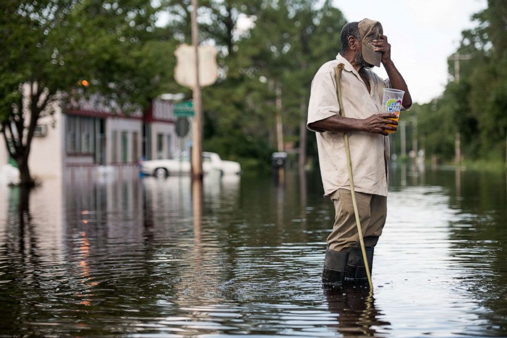 PHOTO: Larry Hickman stands in floodwaters from the Waccamaw River caused by Hurricane Florence in Bucksport, S.C., Sept. 26, 2018.