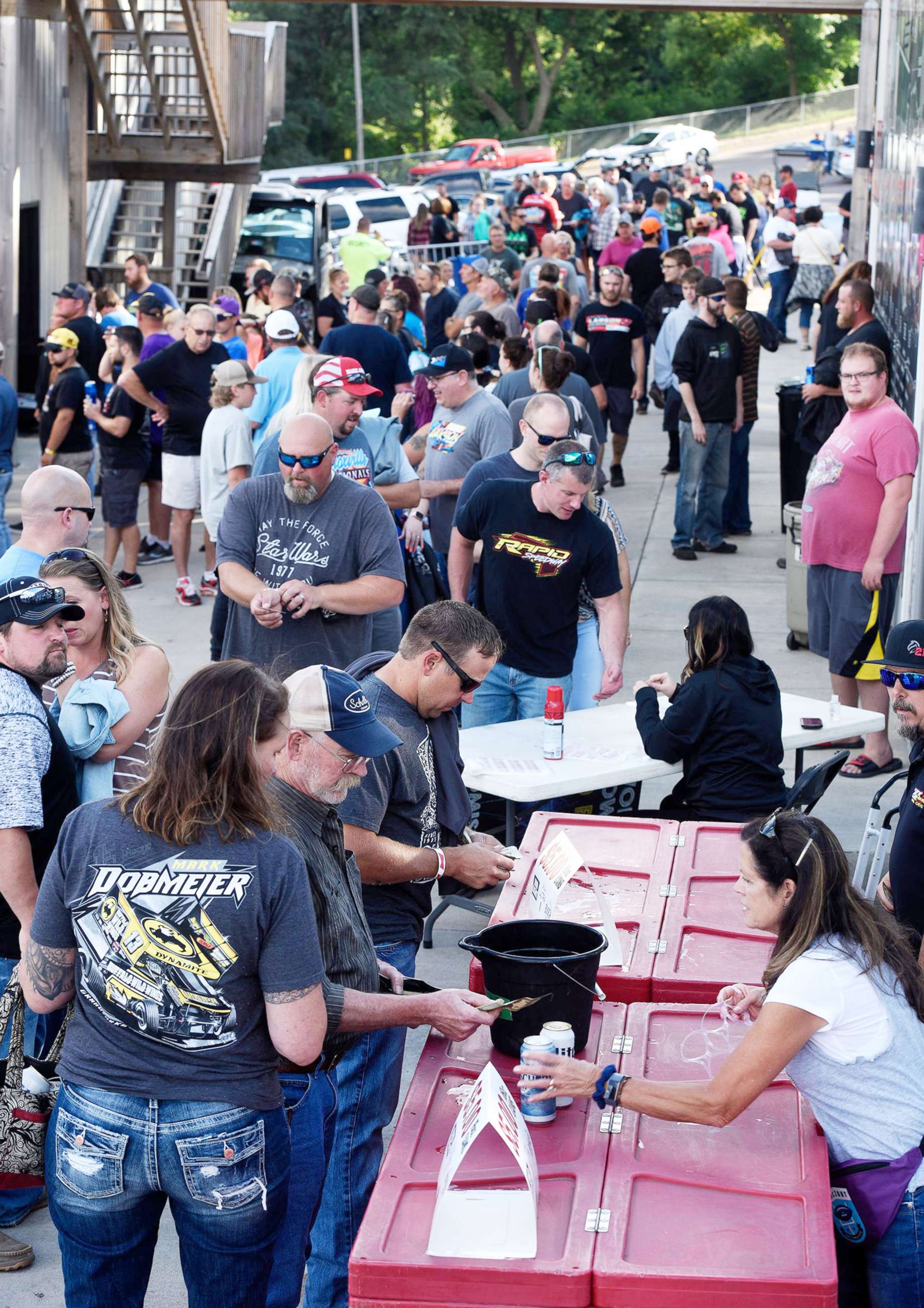 PHOTO: Racetrack fans brave long lines to get into Huset's Speedway during their re-opening night in Brandon, S.D., Aug, 2 2020. The track had been closed since 2017.