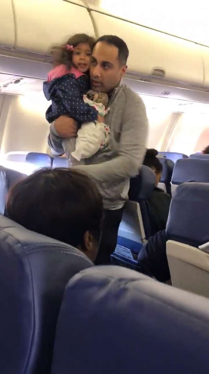 PHOTO: A video grab shows a father and his 2-year-old daughter being removed from a Southwest Airlines flight before takeoff.