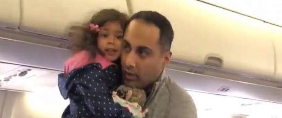 PHOTO: A video grab shows a father and his 2-year-old daughter being removed from a Southwest Airlines flight before takeoff.