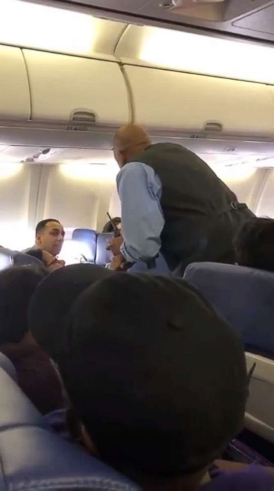 PHOTO: A video grab shows a father and his 2-year-old daughter being removed from a Southwest Airlines flight before takeoff.