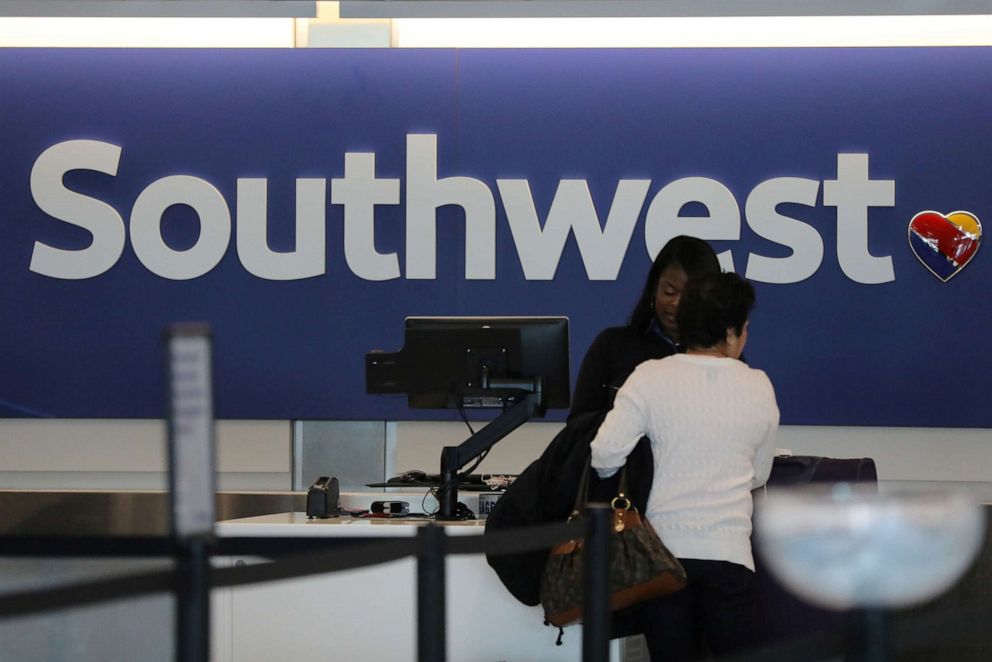 PHOTO: A traveler checks her baggage at the Southwest Airlines terminal at LAX airport in Los Angeles, on Jan. 24, 2017.